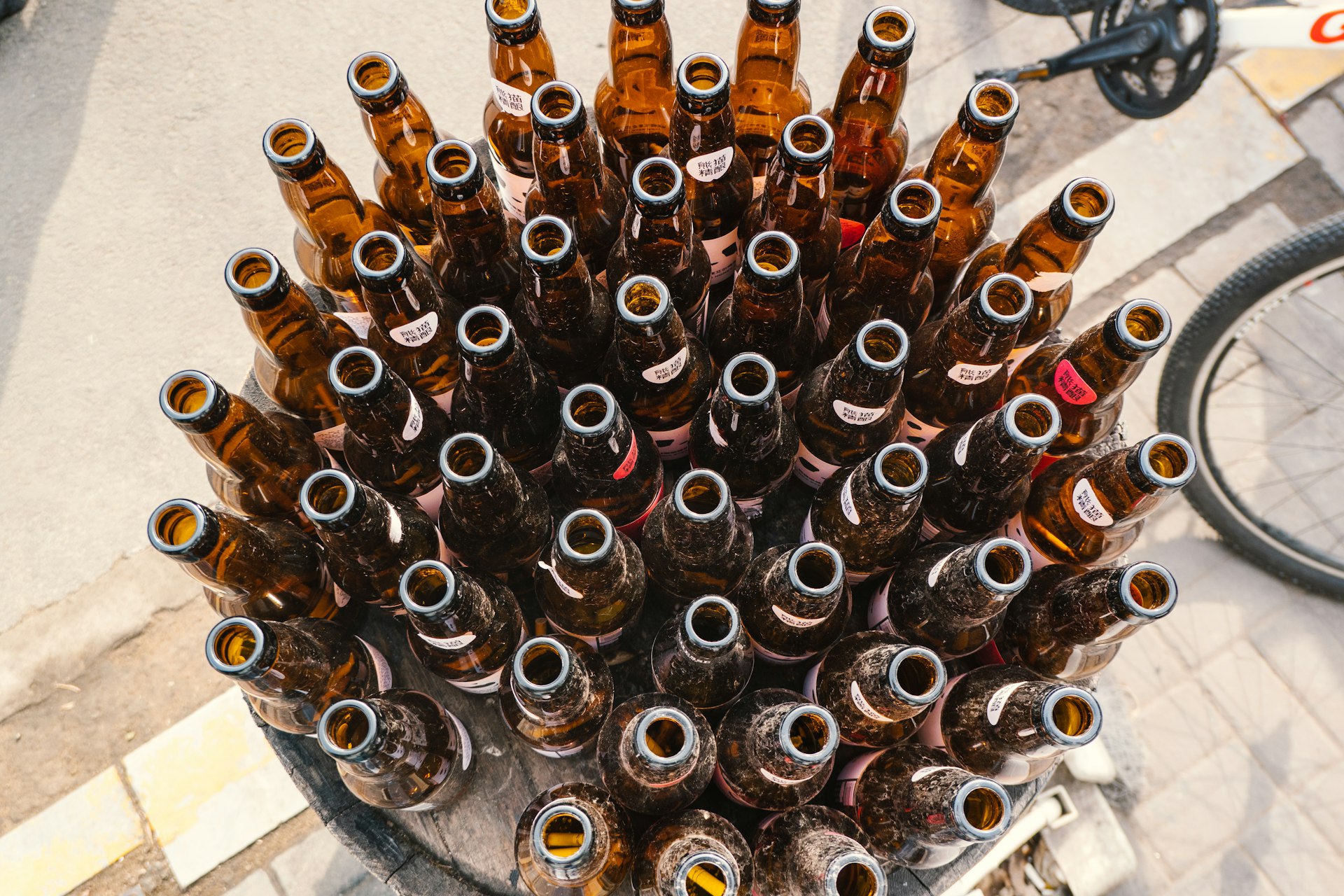 a bunch of beer bottles stacked on top of each other